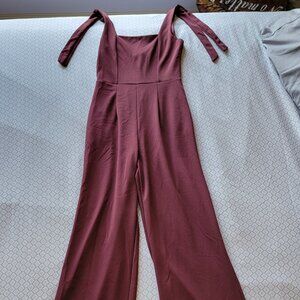 maroon sleeveless jumpsuit w/ pockets